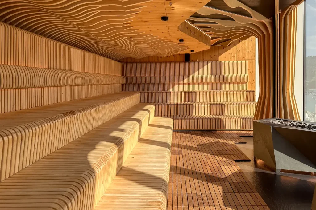 Interior of a spacious sauna with layered wooden seating
