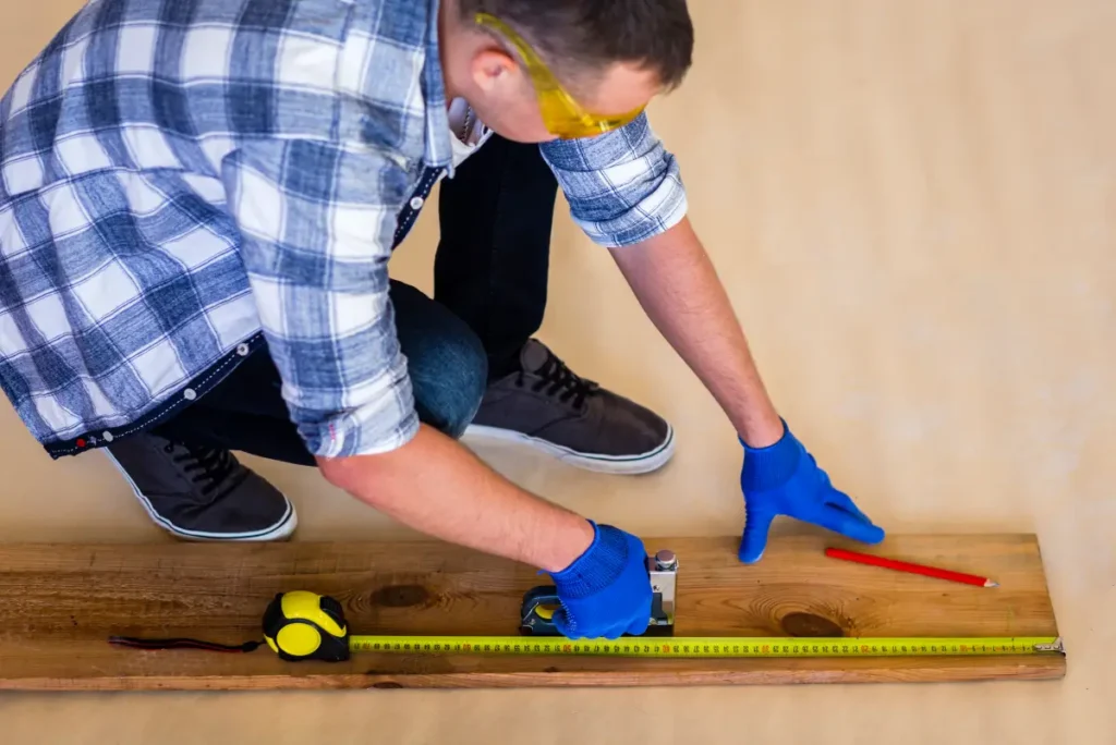 Professional laying out measurements for SPC floor planks.