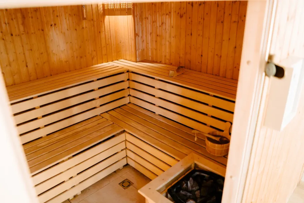 Sauna room with wooden bench seating