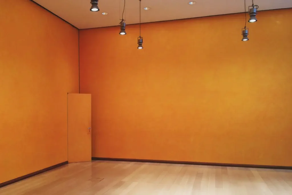 Finished orange wallpaper installation interior room