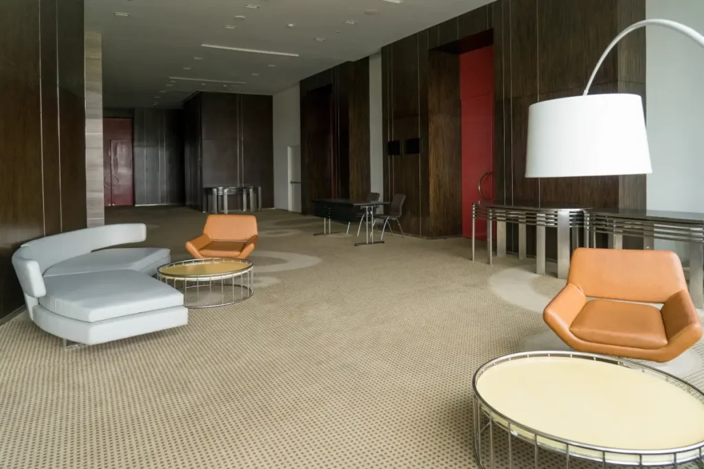 Modern office space with carpet tiles and contemporary furniture.