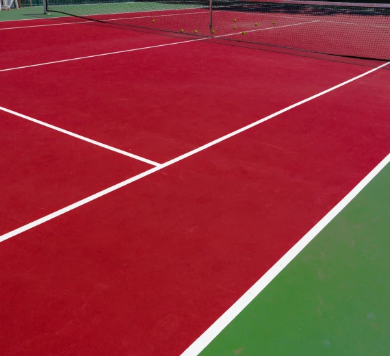 Red and green paddle court with clear white markings.