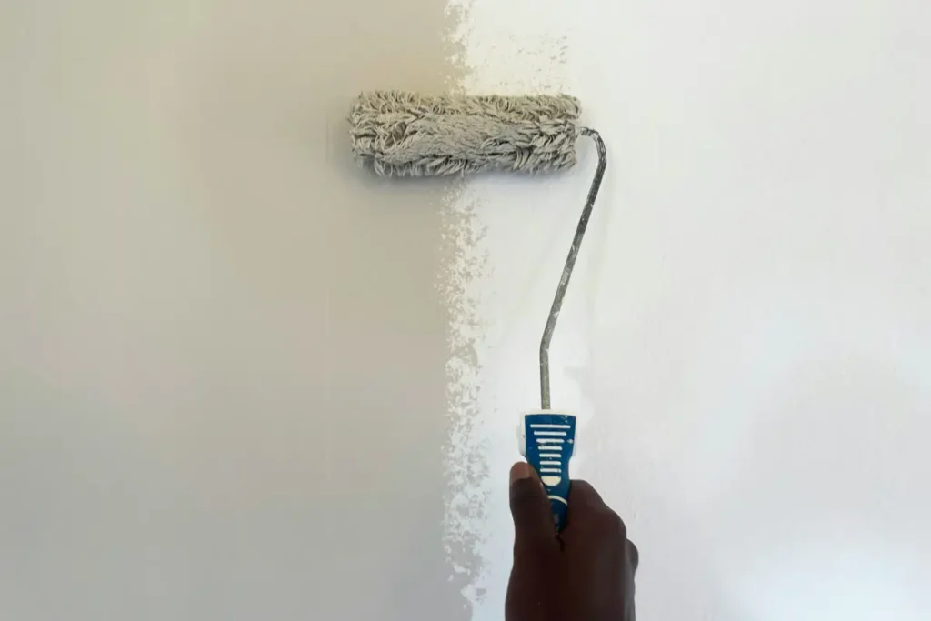 Wall painting roller application technique shown